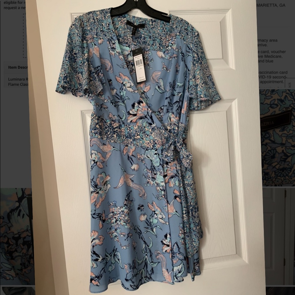 New with tags. “Kyle” blue wrap dress size small. Originally $228.